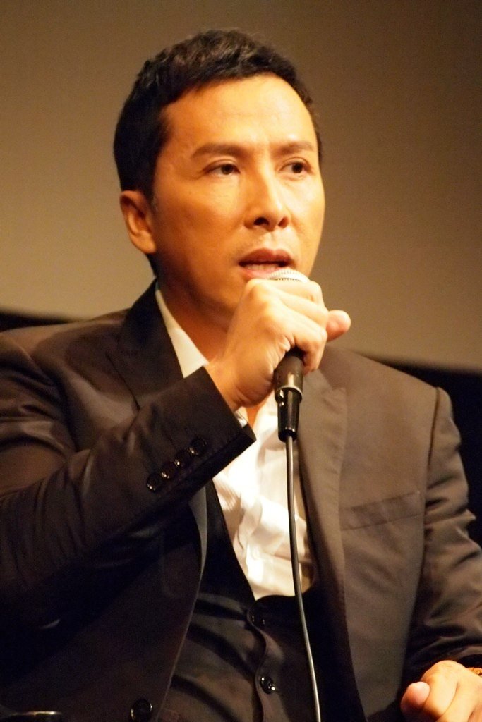 Donnie Yen speaking into a microphone at the New York Asian Film Festival in 2012